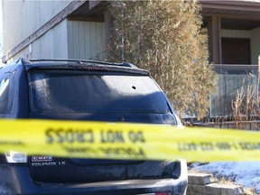 Calgary police hold the scene after reports of shots fired on Beddington Circle NE in Calgary late Saturday March 24, 2018.