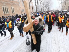 Bishop William McGrattan leaves St. Mary's Cathedral during the outdoor Way of the Cross procession in downtown Calgary on Friday, March 30, 2018. Jim Wells/Postmedia