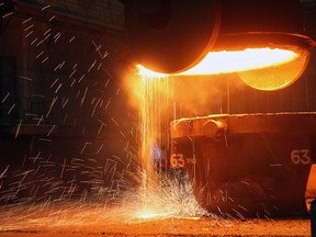 A remote controlled ladle dumps slag after pouring steel at the Dofasco steel plant in Hamilton.