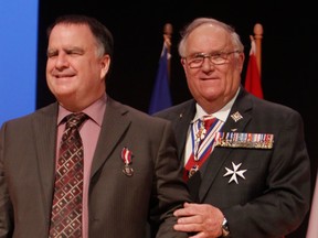 Calgary lawyer Bob Fenton, left, during a 2012 Queen Elizabeth II Diamond Jubilee medal ceremony, with then Lt. Gov. Don Ethel on the right.