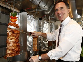 Minister of Finance Bill Morneau vists The Desert Pita and Grill iduring his visit n Calgary for Canada's Workers Benefit on Wednesday March 7, 2018. Darren Makowichuk/Postmedia