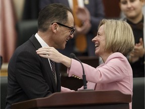 Alberta Finance Minister Joe Ceci hugs Premier Rachel Notley after delivering Budget 2018 in the Alberta Legislature in Edmonton last Thursday.