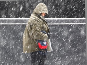 Snow falls in downtown Calgary on Thursday, March 15.