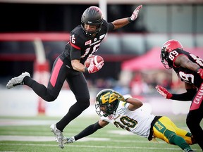 Calgary Stampeders Marquay McDaniel avoids a tackle by Johnny Adams during the 2017 CFL Western Final in Calgary on Sunday, Nov. 19, 2017. (Al Charest/Postmedia)