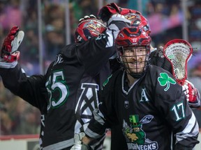 The Calgary Roughnecks Curtis Dickson smiles as he and teammates celebrate scoring on the Rochester Knighthawks during NLL action at the Scotiabank Saddledome in Calgary on Saturday March 17, 2018.  Gavin Young/Postmedia