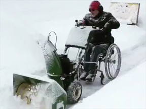 Martin Purvis says it took him a few tries to figure out how to attach his wheelchair to the snowblower