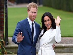 Prince Harry and Meghan Markle in the Sunken Garden at Kensington Palace, London, after the announcement of their engagement.