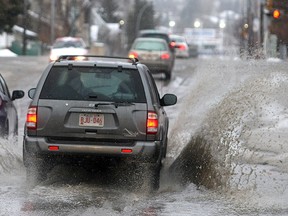A chinook turned Calgary streets into rivers of slush in March 2009. Drivers can expect similar conditions by next Monday, with temperatures forecasted to hit 16 C.