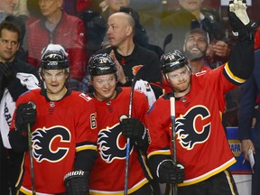 Flames veteran Matt Stajan raises a hand and acknowledges crowd applause during NHL action between the Anaheim Ducks and the Calgary Flames on Wednesday, March 21, 2018 in Calgary at the Saddledome. Stajan was playing in his 1000th NHL game.