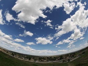 Blue skies with Cumulus clouds role over Nose Hill park in Calgary, Alta on Friday May 30, 2014. Holly Mandarich / Special to The Sun / QMI Agency