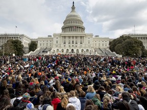 Students rally outside the Capitol Building in Washington, Wednesday, March 14, 2018. Students walked out of school to protest gun violence in the biggest demonstration yet of the student activism that has emerged in response to last month's massacre of 17 people at Florida's Marjory Stoneman Douglas High School. (AP Photo/Andrew Harnik) ORG XMIT: DCAH112