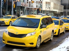 Taxis wait in downtown Calgary on Wednesday February 21, 2018. Darren Makowichuk/Postmedia