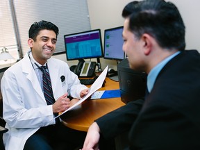 Dr. Omair Siddiqui checks in with a patient. Regular monitoring of your health is a critical step in early detection.