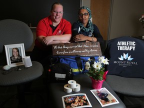 Kate Trippier, left and Mina Fadol during a memorial for their former practicum student, athletic therapist Dayna Brons, at Mount Royal University in Calgary, on Wednesday April 18, 2018. Brons was one of 16 people killed in the Humboldt bus crash on April, 6 2018 near Tisdale, Sask.