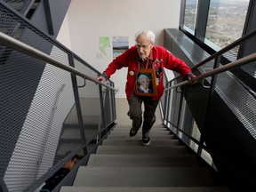 Richard Guy, 101, climbs the last few flights of stairs during the Alberta Wilderness Association Climb for Wilderness at the Bow Building in Calgary on Saturday April 21, 2018.