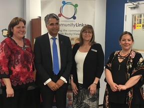 Alberta Community and Social Services Minister Irfan Sabir poses with board members and staff of North Rocky View Community Links Society in Airdrie.