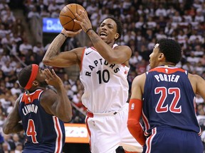 DeMar DeRozan of the Raptors drives for a shot over Ty Lawson of the Washington Wizards in Game 2 of their Eastern Conference first round playoff series at the Air Canada Centre in Toronto on Tuesday night. The Raptors rolled past the Wizards 130-119.