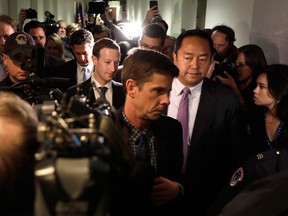 Mark Zuckerberg is surrounded by media while walking between meetings with senators on Capitol Hill yesterday.