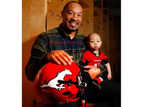 Deron Mayo with his daughter Maliya, the linebacker retired from the Calgary Stampeders after six seasons with the team. Al Charest/Postmedia