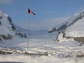 The Columbia Icefield, North America's most visited glacier, is shown in this photo taken May 5, 2015 from the Icefield Interpretive Centre. A Calgary man has survived a 30-metre fall into a glacier crevasse in the Columbia icefields area of Jasper National Park. Parks Canada says the 24-year-old was snowshowing with a friend Sunday on the Athabasca Glacier when he fell deep into the ice and was knocked unconscious. The pair were not wearing safety ropes or harnesses.