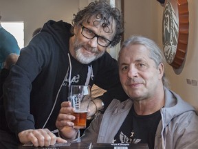 Famed wrestler Bret 'The Hitmaní Hart (right) and Village Brewery co-founder Jim Button are pictured with packs of Village Hitmanóa new beer by Village Breweryóon Wednesday, April 4, 2018. KERIANNE SPROULE/POSTMEDIA