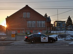 Police guard the scene of a late night officer involved shooting in Bridgeland on Tuesday morning April 10, 2018.