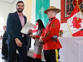 New Canadian Hazem Abdelnaien smiles after receiving his Canadian citizenship in Calgary. Despite our troubles, Alberta remains the promised land, says columnist Chris Nelson.