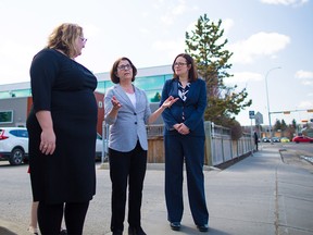 Celia Posyniak, Executive Director at Kensington Clinic, centre, tours Minister of Health Sarah Hoffman, left and Minister of Justice and Attorney General Kathleen Ganley around the bubble zone at the women's health clinic in Calgary on Wednesday April 25, 2018.  Bill 9, the Protecting Choice for Women Accessing Health Care Act, would create a 50 metre zone around women's health clinics to prevent harassment and fine repeat offenders. Gavin Young/Postmedia