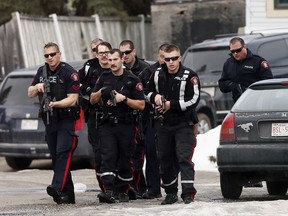 Calgary Police tend to Const. Jordan Forget after he was shot in Abbeydale on Tuesday March 27, 2018.