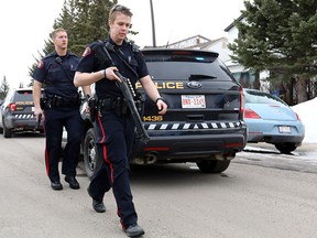 Calgary police at the scene in Abbeydale on Tuesday March 27, 2018 where a police officer was shot.