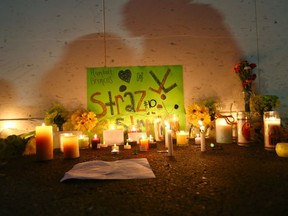 A vigil was held in Airdrie Friday night to support injured Humboldt Broncos player Ryan Straschnitzk and his teammates.