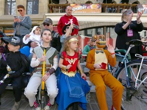 Costumed fans line Stephen Ave and take in the fun during the Parade of Wonders in downtown Calgary to kick off the Calgary Comic & Entertainment Expo Friday, April 27, 2018.  Jim Wells/Postmedia