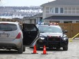 Calgary police investigate the scene of a double killing in Evanston on April 20, 2018.