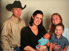 Sarah Degraw in a family portrait with husband Andy, sons Rider and Sam and stepdaughter Meghan. The Calgary Police Service constable passed away on April 11, 2018 after suffering a stroke.