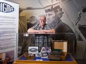 U of C history professor John Ferris beside an Enigma machine display. Ferris is writing the official 100-year history of British intelligence code-breaking.