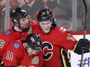 Calgary Flames Mark Jankowski celebrates with teammates after scoring against the Vegas Golden Knights at the Scotiabank Saddledome Saturday, April 7, 2018.
