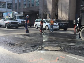 City crews work to repair a sinkhole on 9th Avenue S.W. on April 18, 2018. The city is expecting to repair up to 1,000 potholes this spring.
