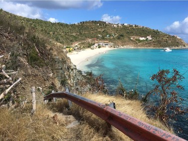 Ivan's bar (in yellow) is a favourite haunt of country star Kenny Chesney. The beach and hillside on Jost Van Dyke show the scars of Hurricane Irma. Photo, Michele Jarvie