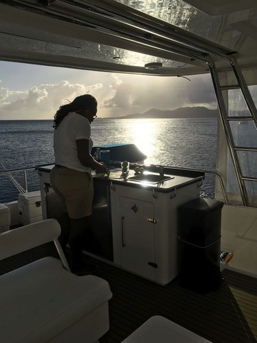 Ship's mate Kay Bartley makes afternoon cocktails on the Prodigious, a catamaran that is part of  The Moorings chartered business in the British Virgin Islands. Photo, Michele Jarvie