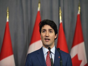 Prime Minister Justin Trudeau speaks during a press conference at The Canadian High Commission in London. The pressure he's under is coming from the first day of the Liberals' national convention.
