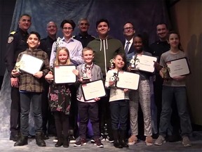 Kids receive commendations for calling 911 by City of Calgary rescue officials.