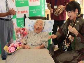 This picture received from Kikaicho Town Hall via Jiji Press and taken on September 18, 2017 shows 117-year-old Nabi Tajima (2nd L) in Kikaicho on Kikai island of Kagoshima prefecture. A 117-year-old Japanese woman, thought to be the world's oldest person, has died, a local official told AFP on April 22, 2018. Nabi Tajima, who was born August 4, 1900, died around 8:00 pm (1100 GMT) on April 21 at a hospital on her native Kikai Island in Kagoshima region, according to Susumu Yoshiyuki, a health and welfare official. / AFP PHOTO / KIKAI TOWN VIA JIJI PRESS / JIJI PRESS / Japan OUTJIJI PRESS/AFP/Getty Images