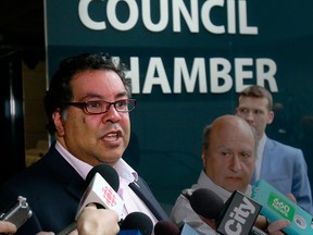 Calgary Mayor Naheed Nenshi speaks to media outside Council Chambers where members were discussing the city's olympic bid and plebiscite. Tuesday, April 10, 2018. Dean Pilling/Postmedia