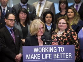 Premier Rachel Notley talks about new legislation giving Alberta the power to control its flow of oil and gas as members of the Alberta NDP government caucus listen on Monday, April 16, 2018 in Edmonton.