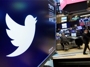 FILE- In this Feb. 8, 2018, file photo the logo for Twitter is displayed above a trading post on the floor of the New York Stock Exchange.