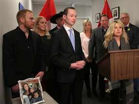 Calgary MP Michelle Rempel and Edmonton MP Michael Cooper appear at a press conference in Calgary on April 3, 2018, with family members of Sara Baillie and her daughter Taliyah Marsman, who were killed in 2016.