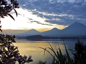 The sun sets over Lake Burera near Volcanoes National Park in Rwanda.