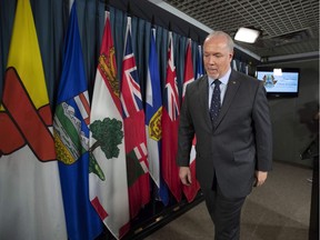 B.C. Premier John Horgan leaves a press conference, after discussing his meeting with Prime Minister Justin Trudeau and Alberta Premier Rachel Notley on the deadlock over Kinder Morgan's Trans Mountain pipeline expansion, on Parliament Hill in Ottawa on Sunday, April 15, 2018.