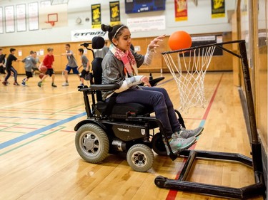 Hana Hassan, 12, during physical education class at A.E. Cross school in Calgary. Leah Hennel/Postmedia