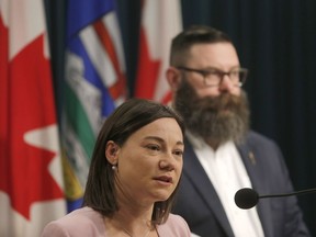 NDP Environment Minister Shannon Phillips and Municipal Affairs Minister Shaye Anderson discuss funding for three flood mitigation projects in Calgary's inner city on May 1, 2018.